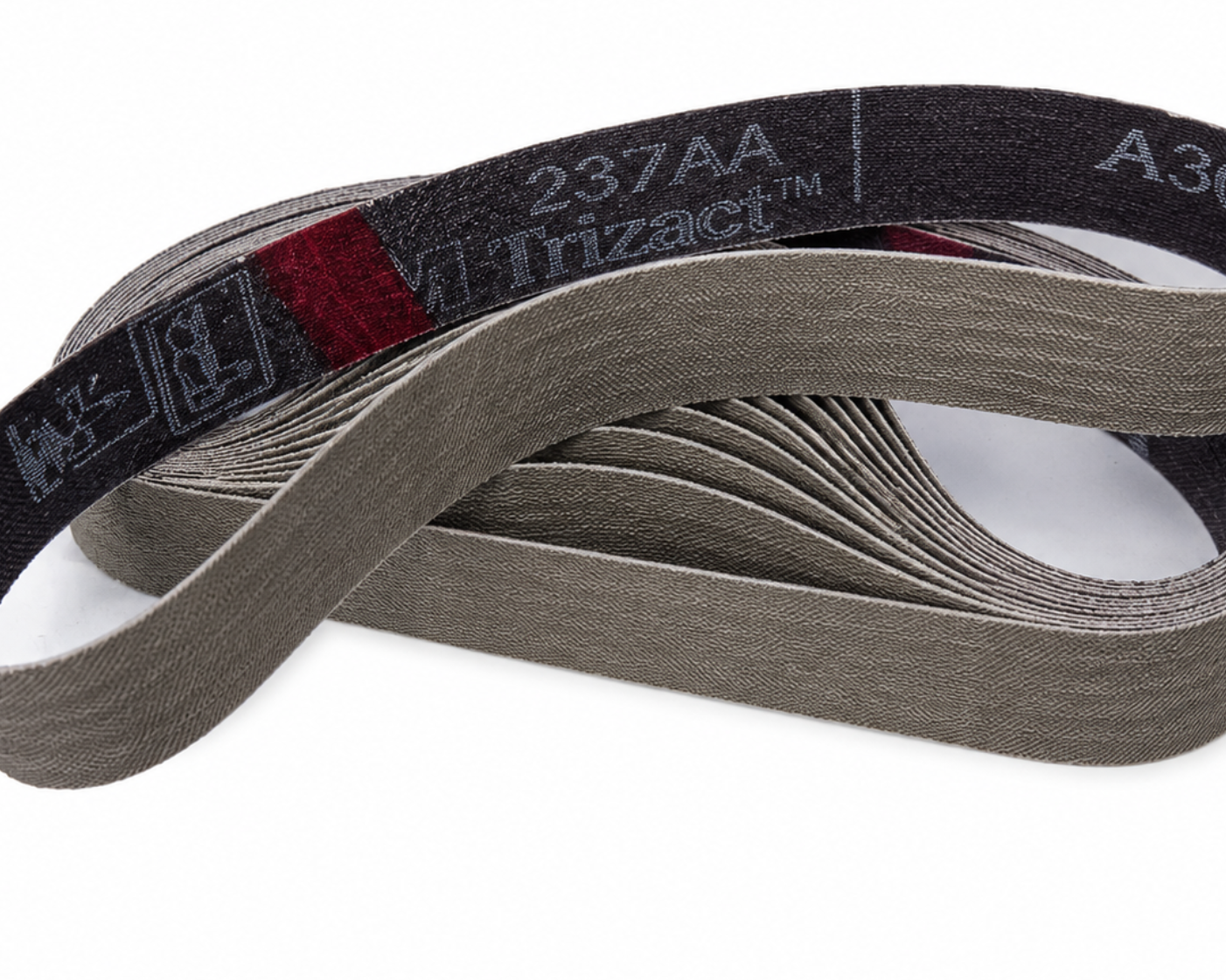 A coiled gray abrasive sanding belt with a black inner liner showing the brand name 'Trizact' and model '237AA A30'.